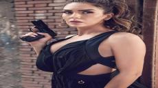 مي فخري بروح الأكشن والمسدس في أحدث جلسة تصوير