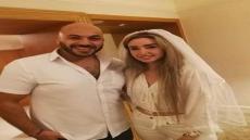 صورة هنا الزاهد من عقد قرانها